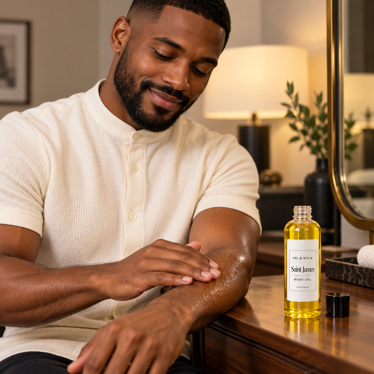 Saint James body oil — Black man applying body oil